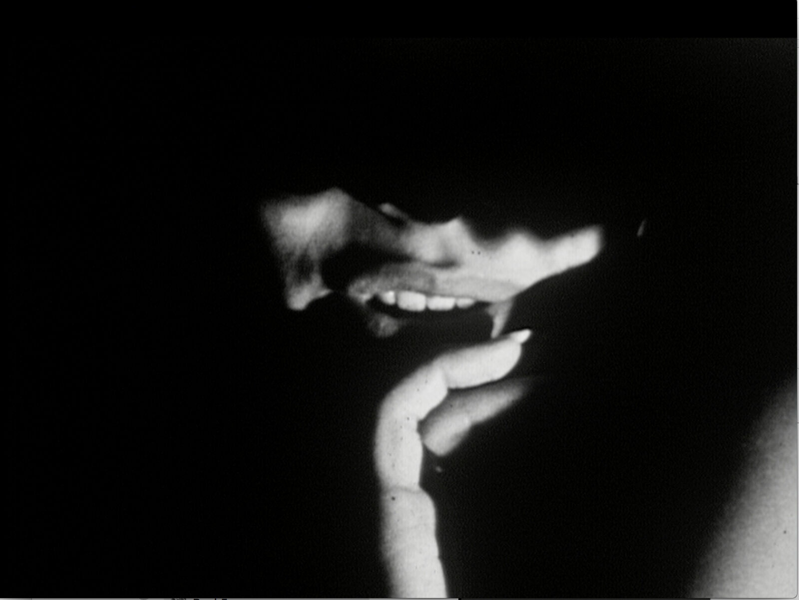 A man and a woman laying on top of a bed.