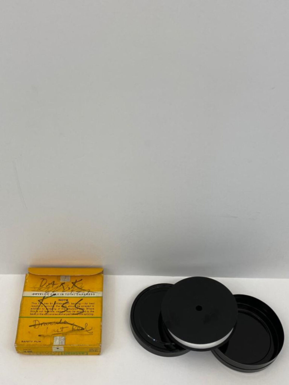 A man and a woman laying on top of a bed.