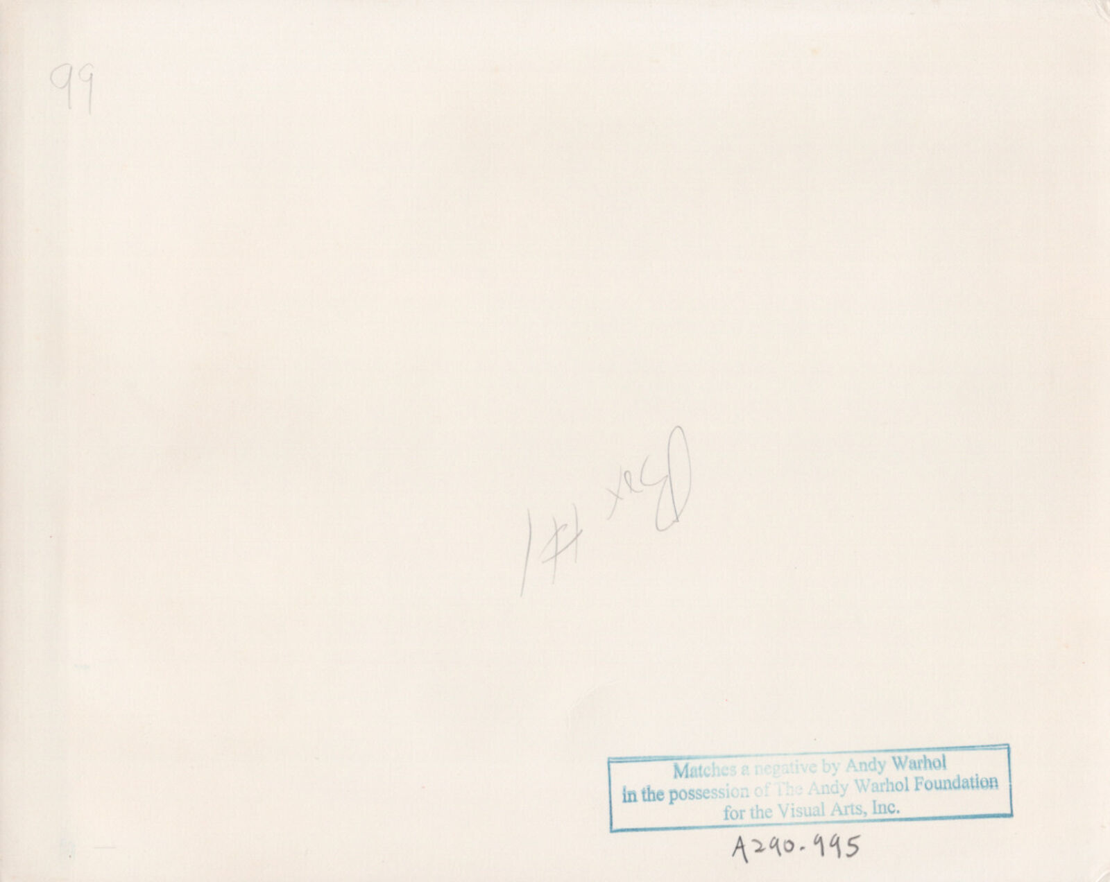 A black and white photo of a woman sitting at a table.