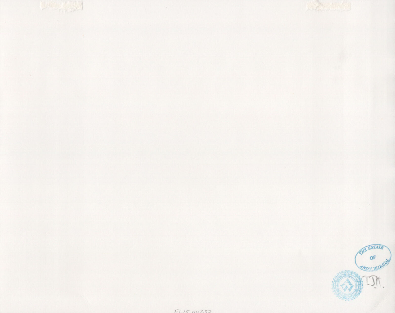 A black and white photo of a house in the woods.