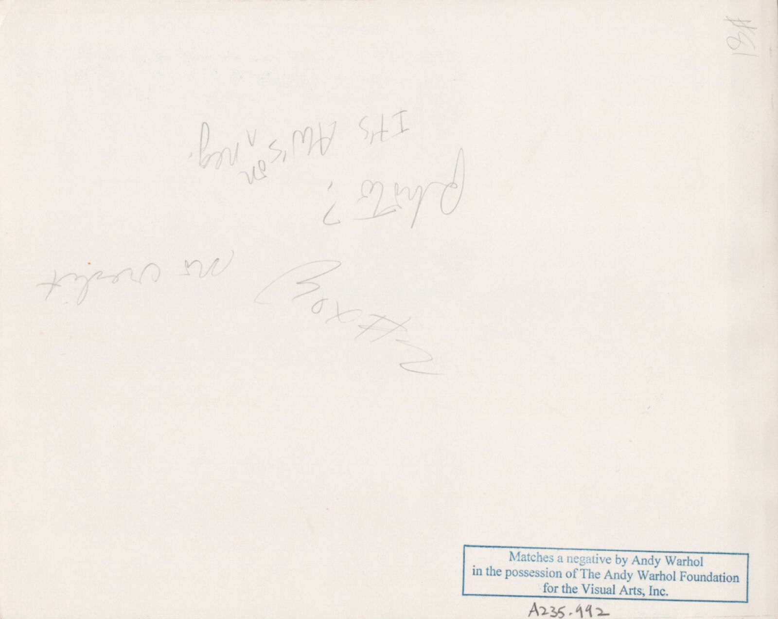 A black and white photo of a man in a tuxedo and a woman in a dress.