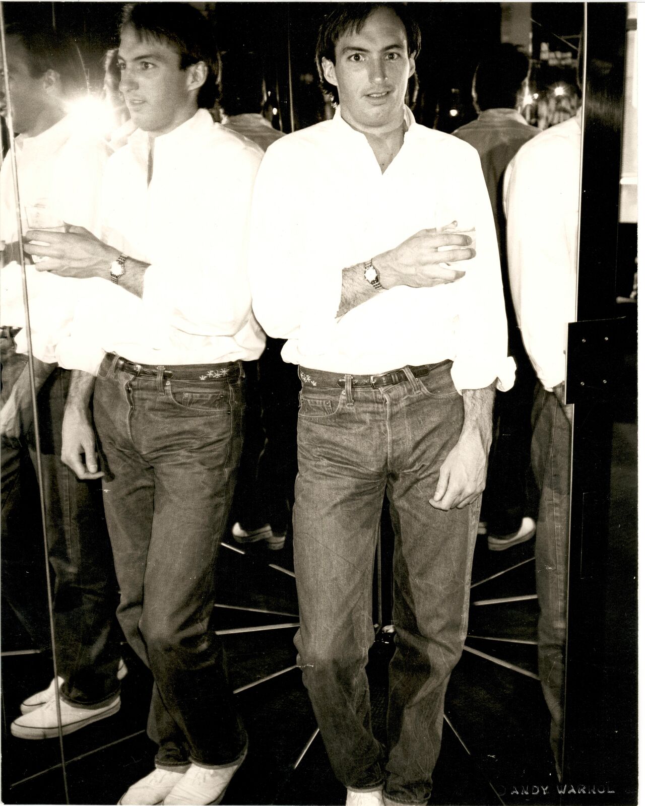A black and white photo of two men standing next to each other.