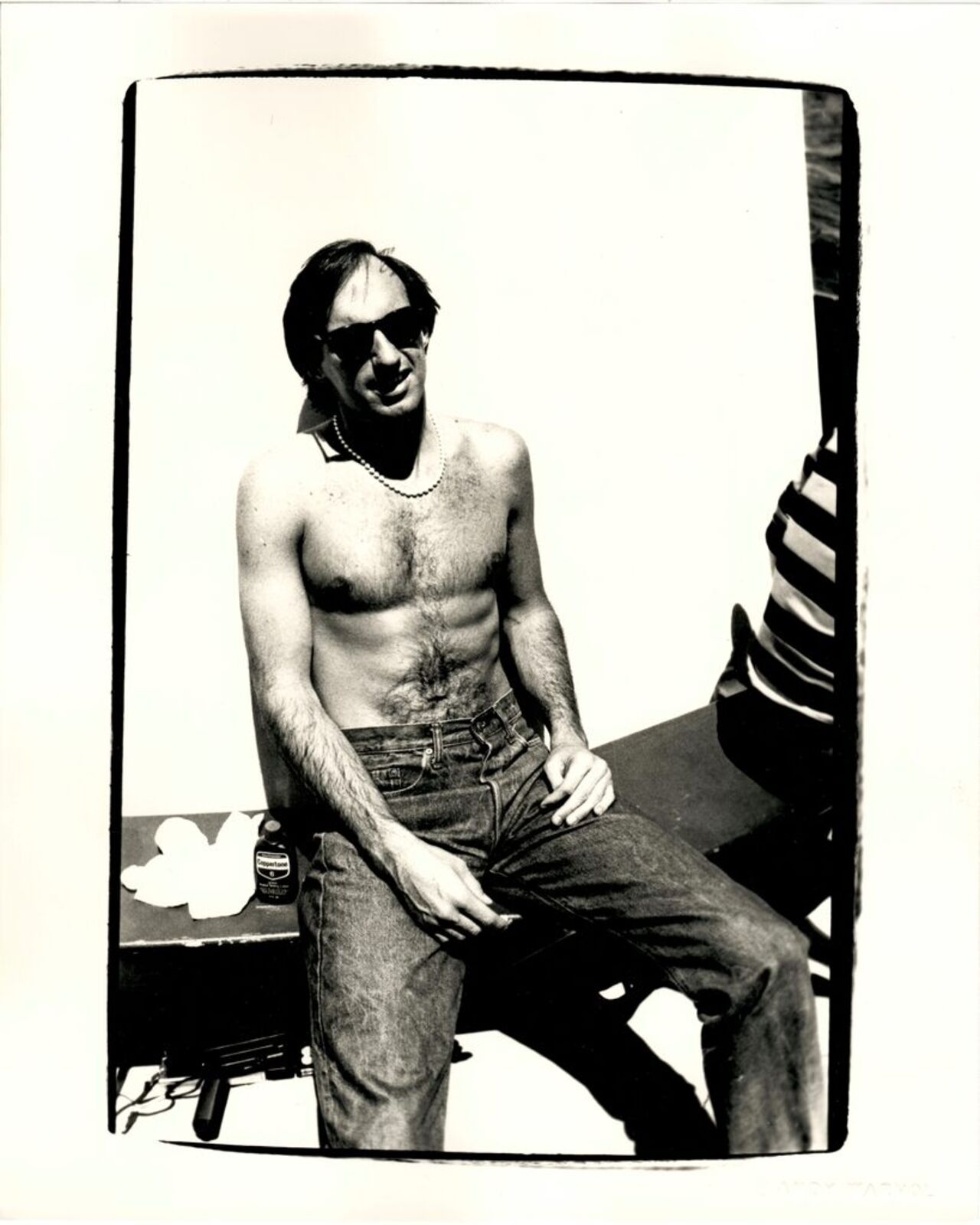 Jon Gould Sunbathing Shirtless with Jeans Seated in Cape Cod