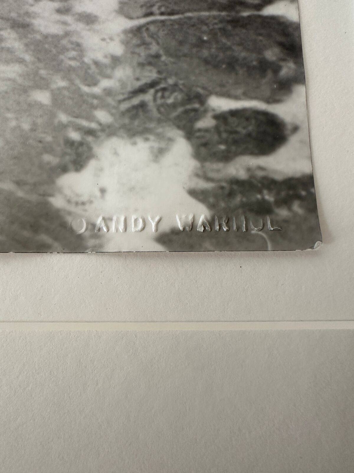 A man in a bathing suit standing in the water.