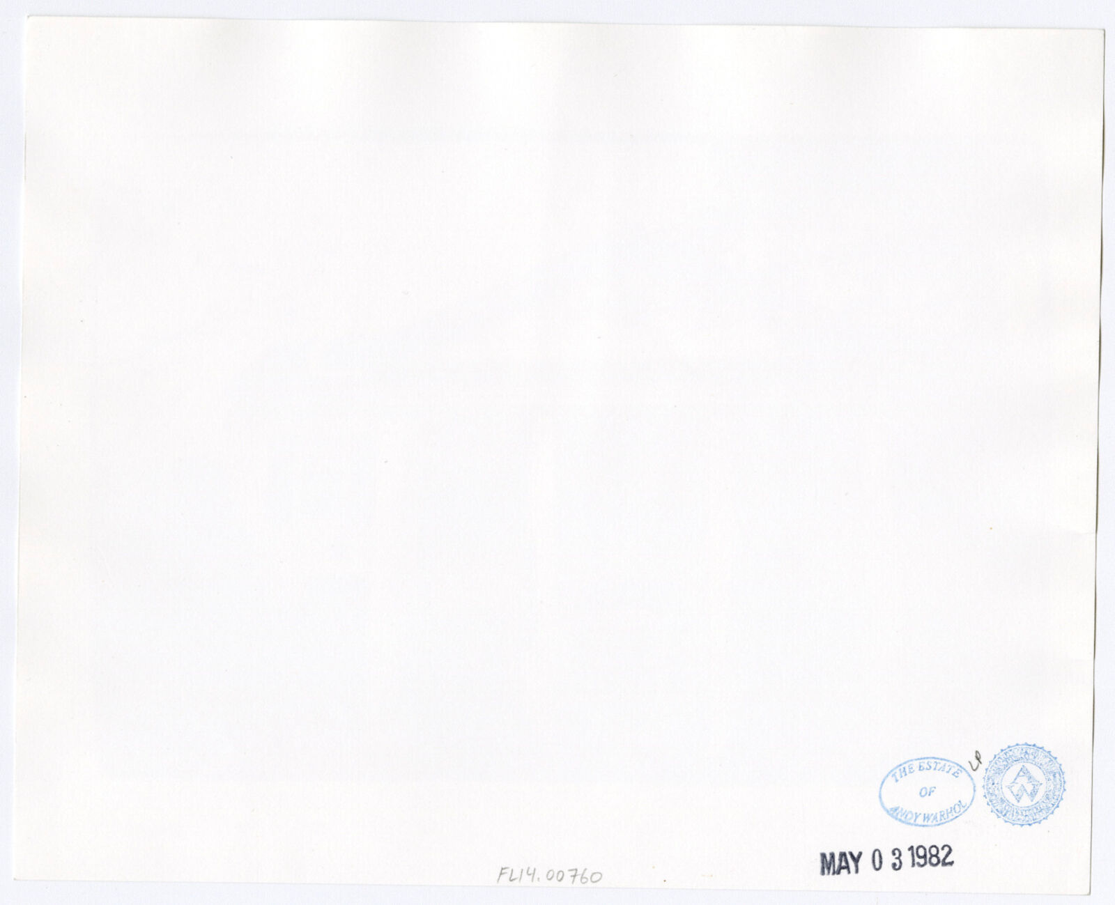 A black and white photo of a large white house.