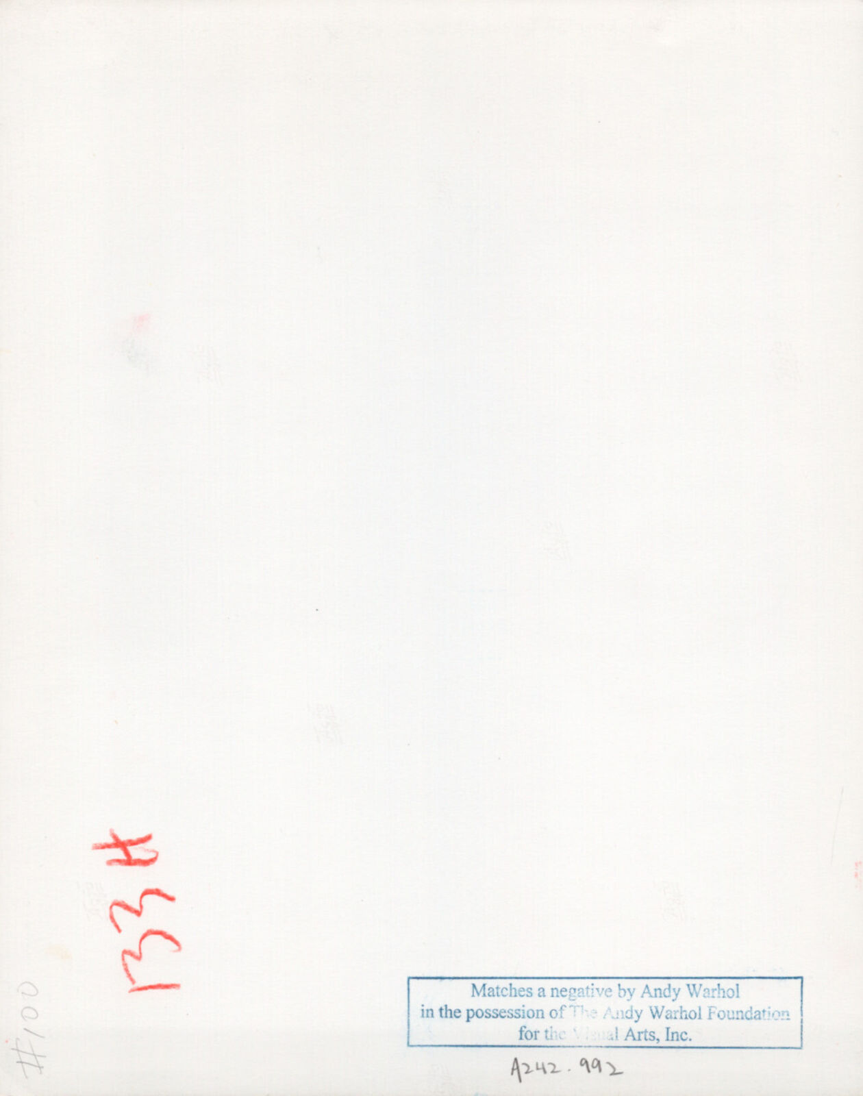 A man and a woman standing next to each other in front of a tree.