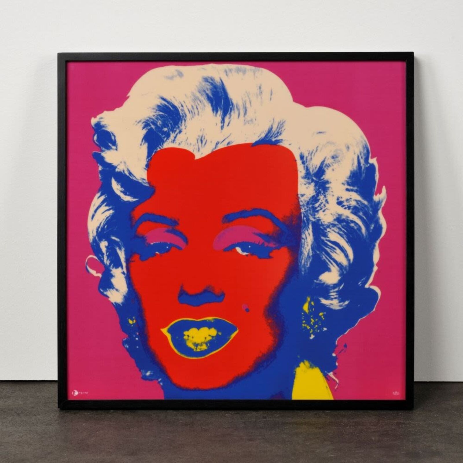 A bold pop-art portrait featuring a stylized face with vibrant red skin, blue hair, and yellow lips against a magenta background.