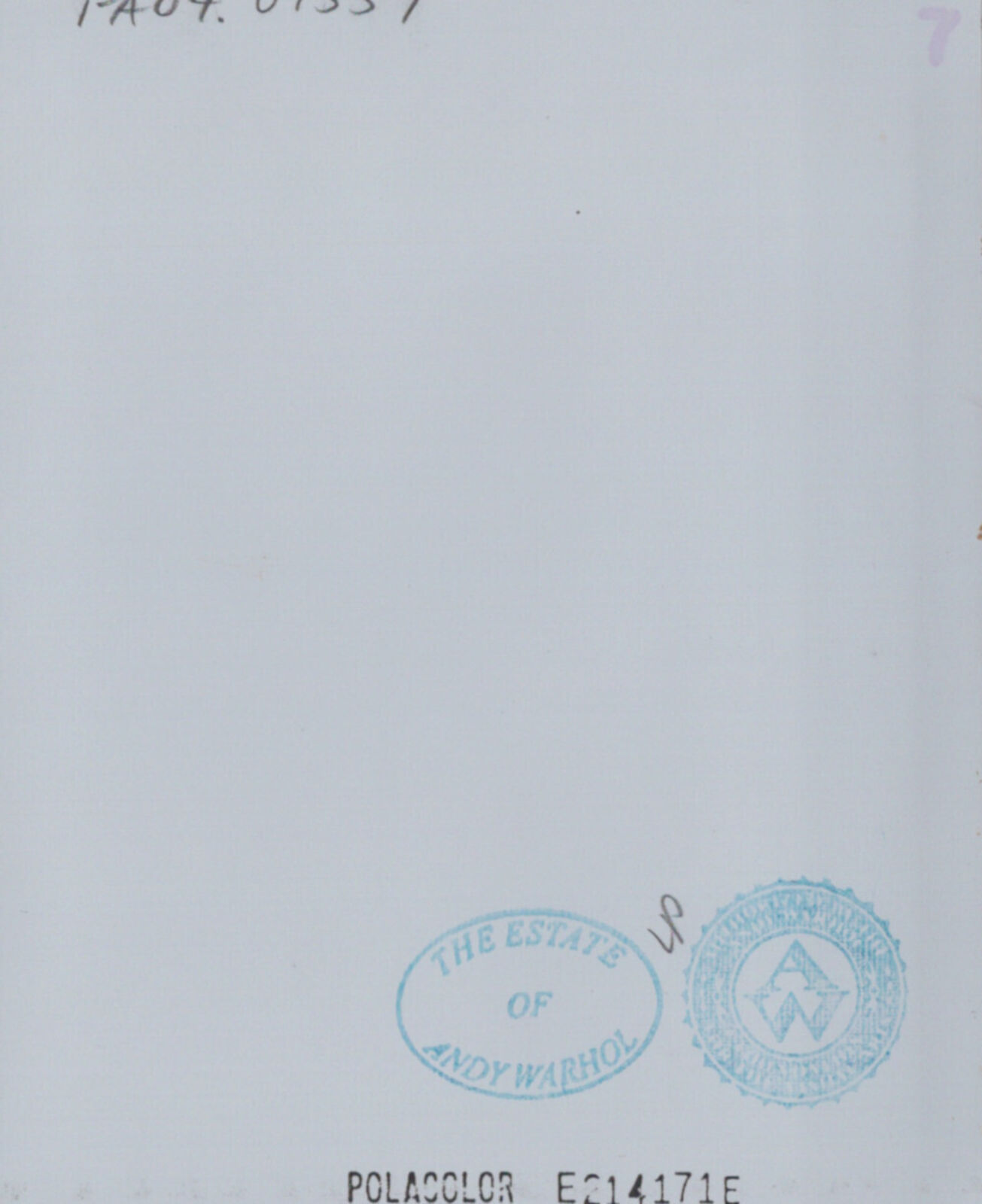 A woman with curly hair wearing a red dress.