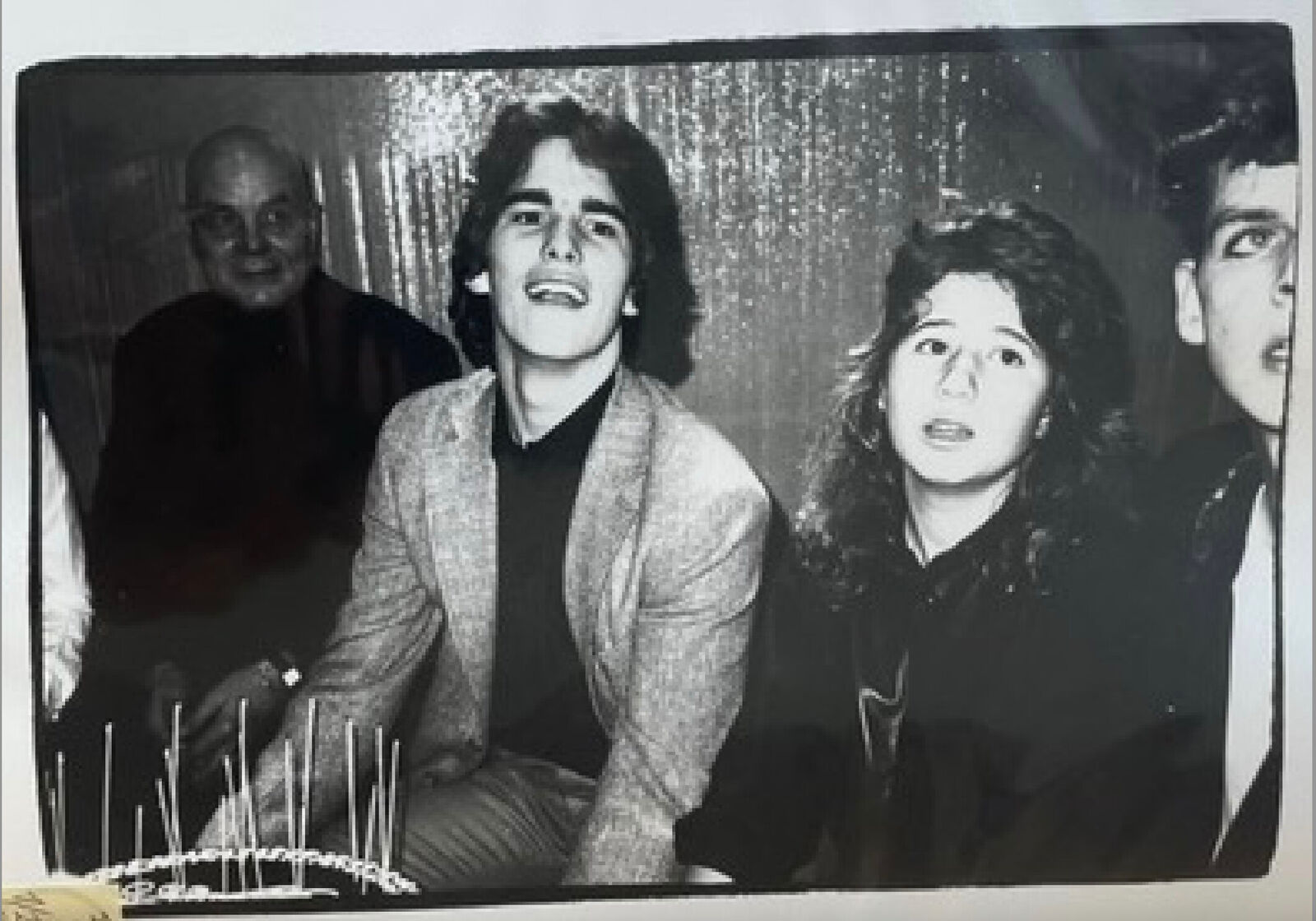 A black and white photo of a group of people posing for a picture.