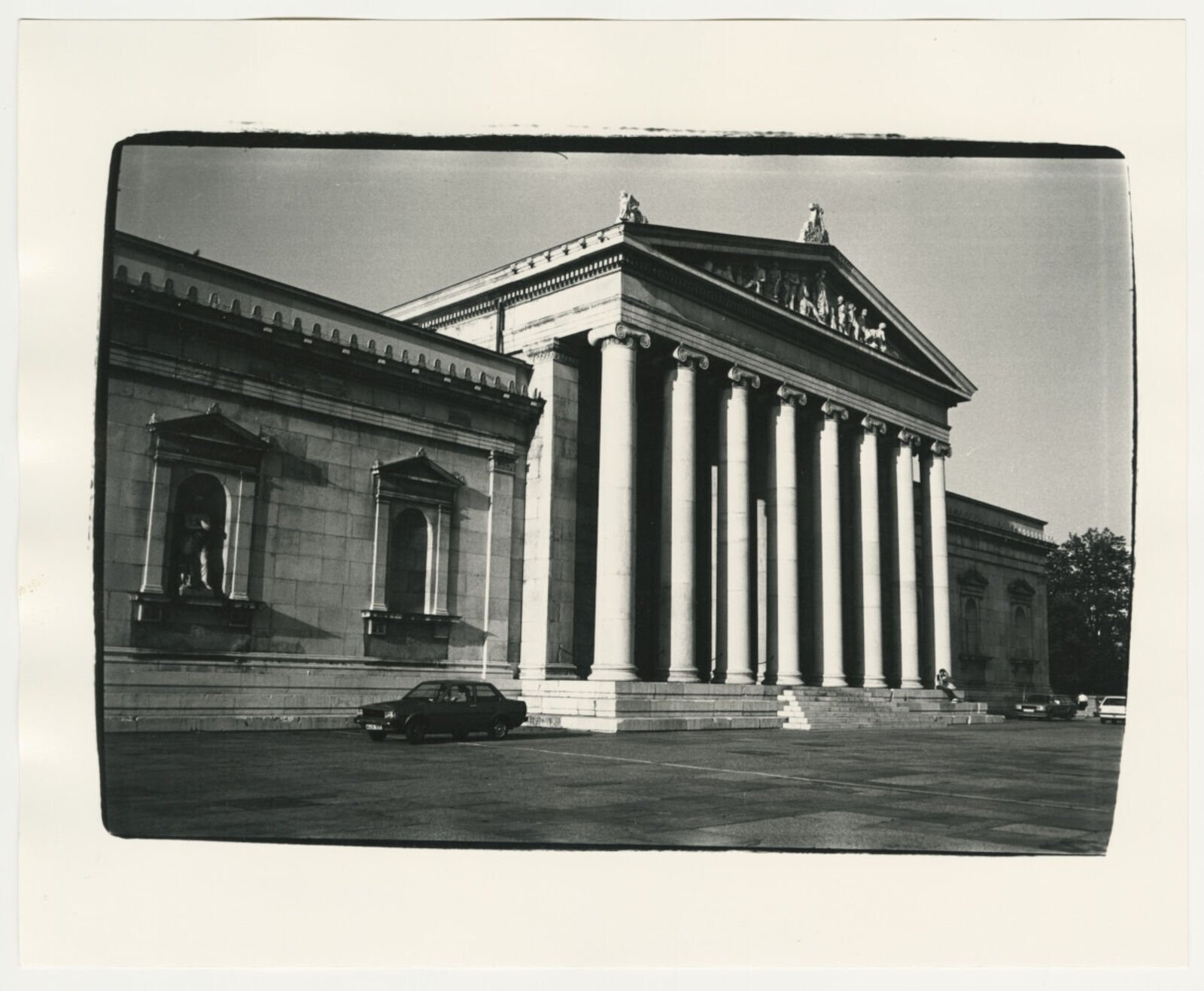 A black and white photo of a building with columns.