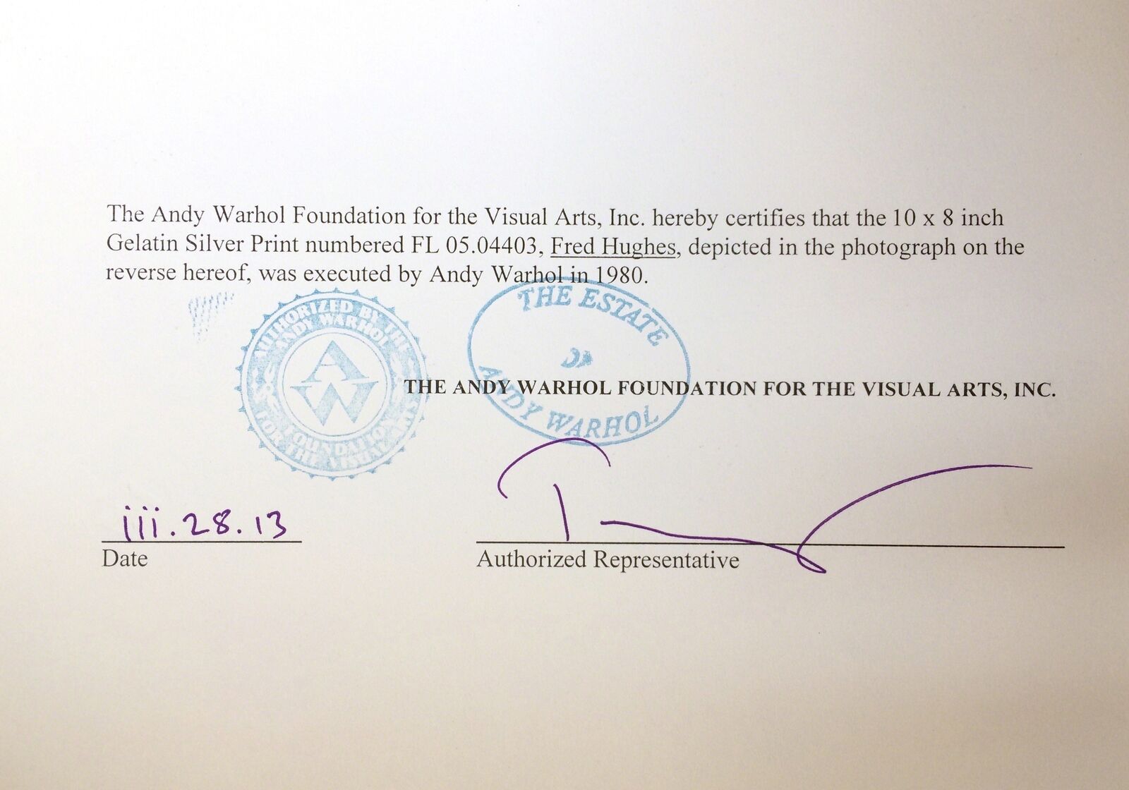 A man sitting on a couch next to a table.