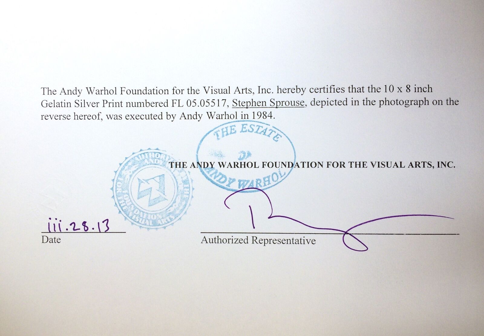 A man sitting on a chair with his legs crossed.