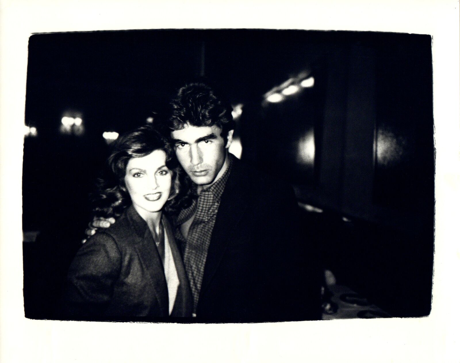 A black and white photo of a man and a woman.