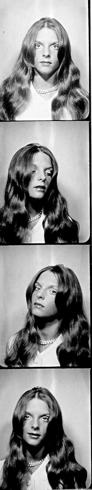 a black and white photo of a woman with long hair