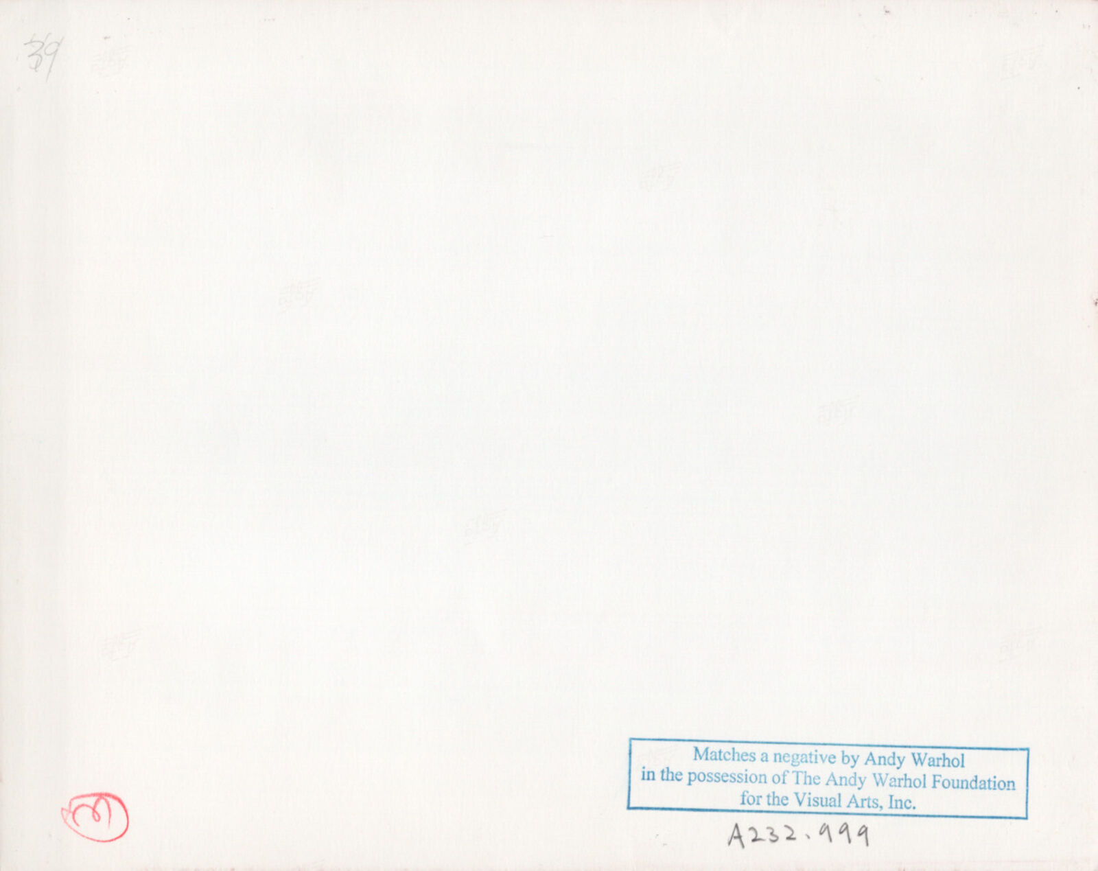 A man holding a baby while sitting next to two young boys.