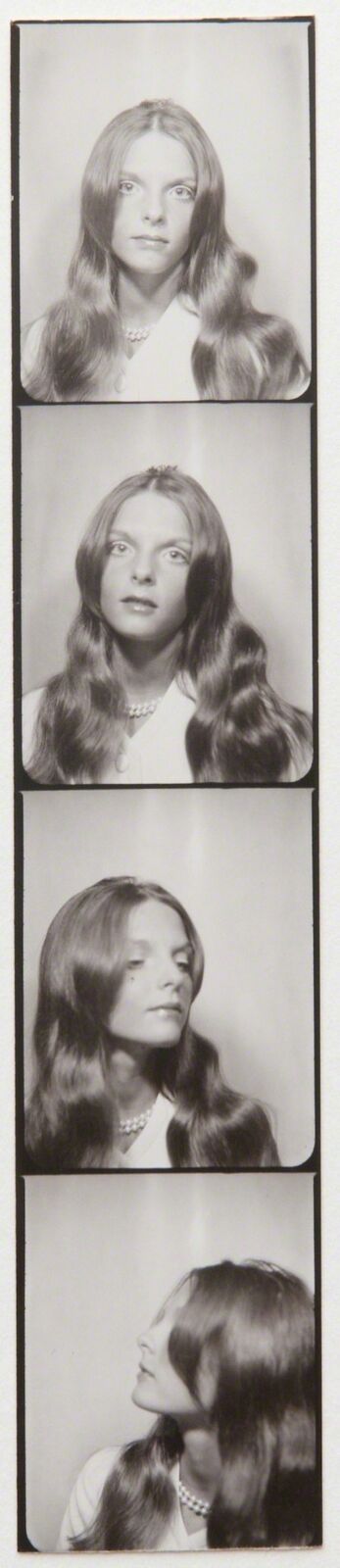 a black and white photo of a woman with long hair