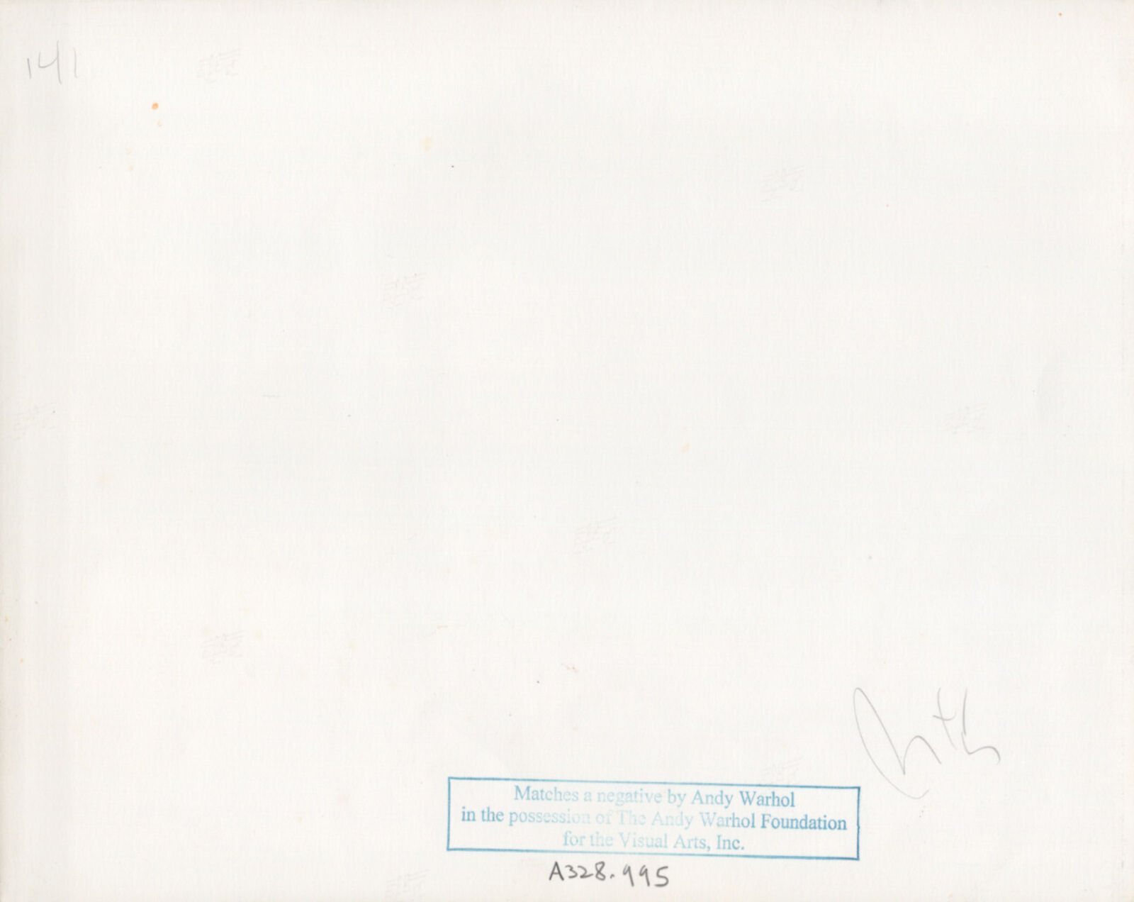 A black and white photo of a woman sitting at a table with a drink.