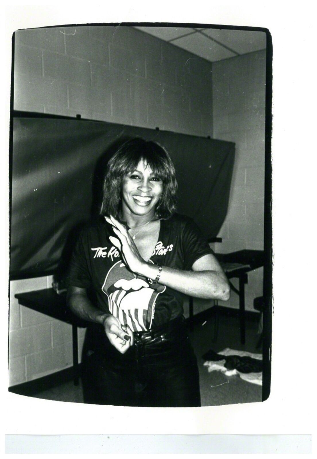 A black and white photo of a woman in a room.