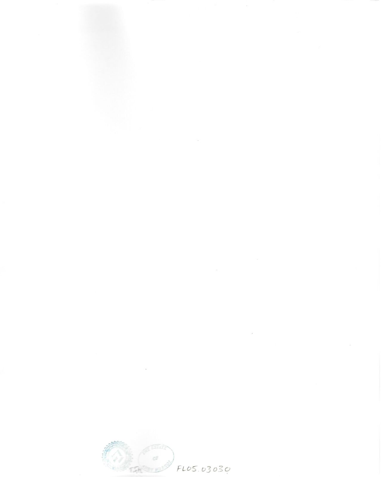 A man sitting at a piano talking on a phone.