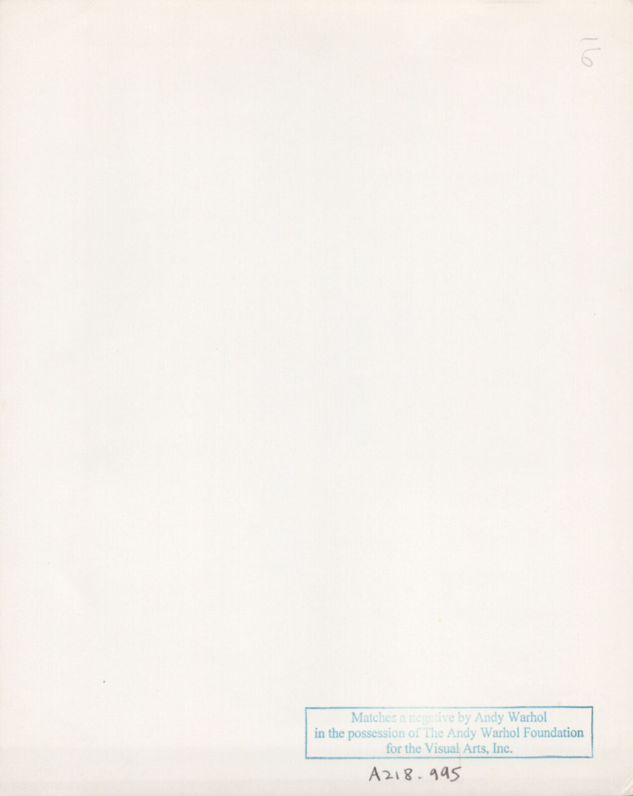 A black and white photo of a woman in fishnet stockings.