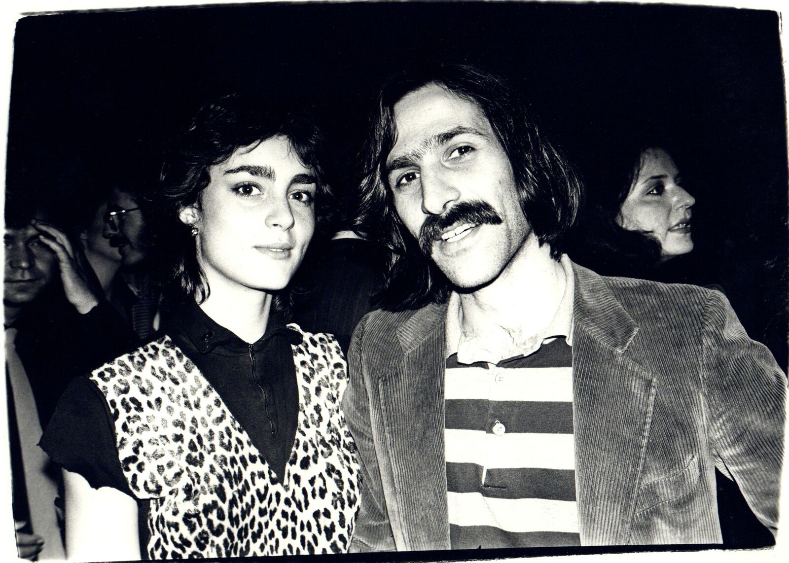 A man and a woman standing next to each other.