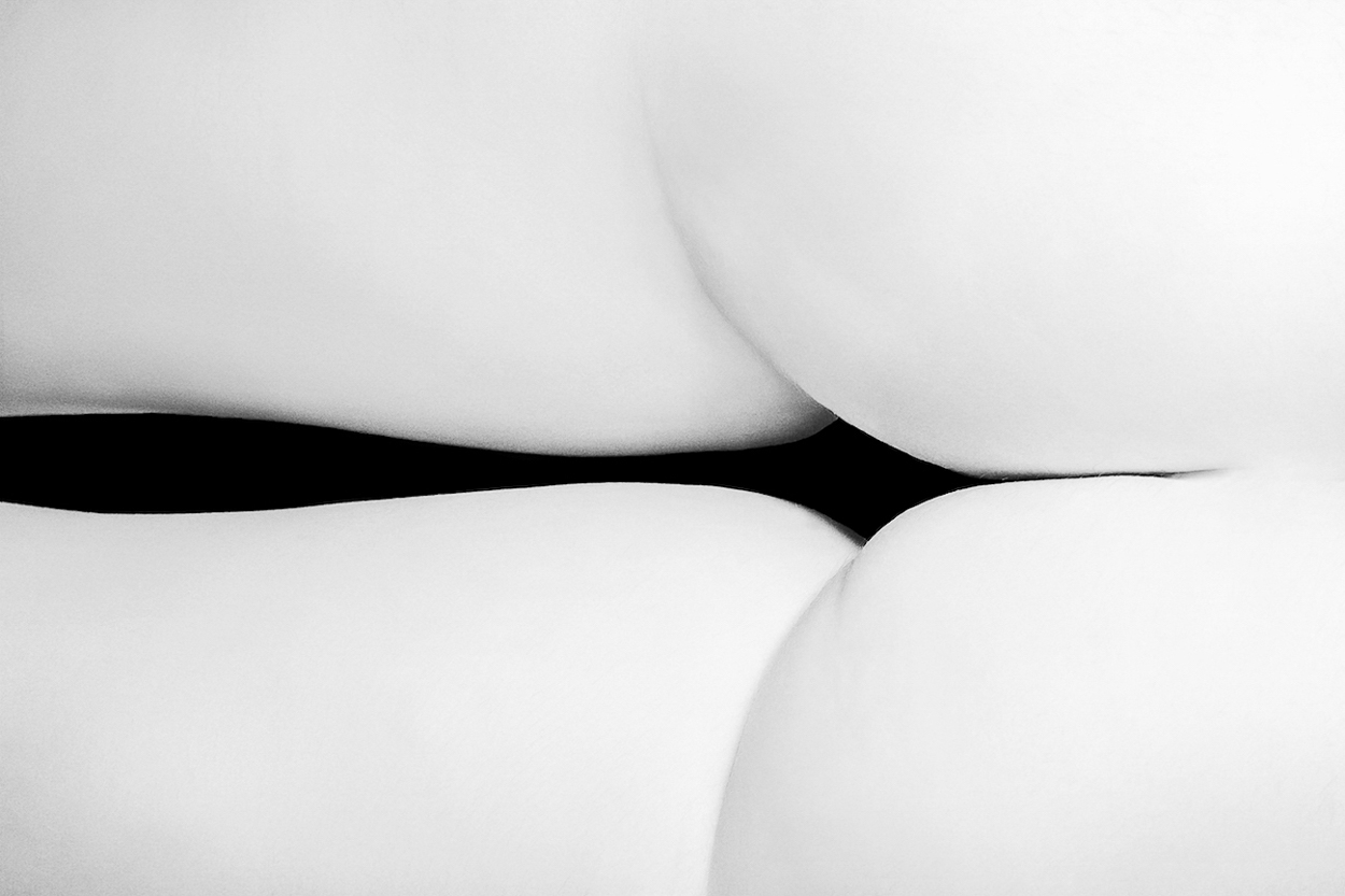 A black and white photo of a woman's butt.