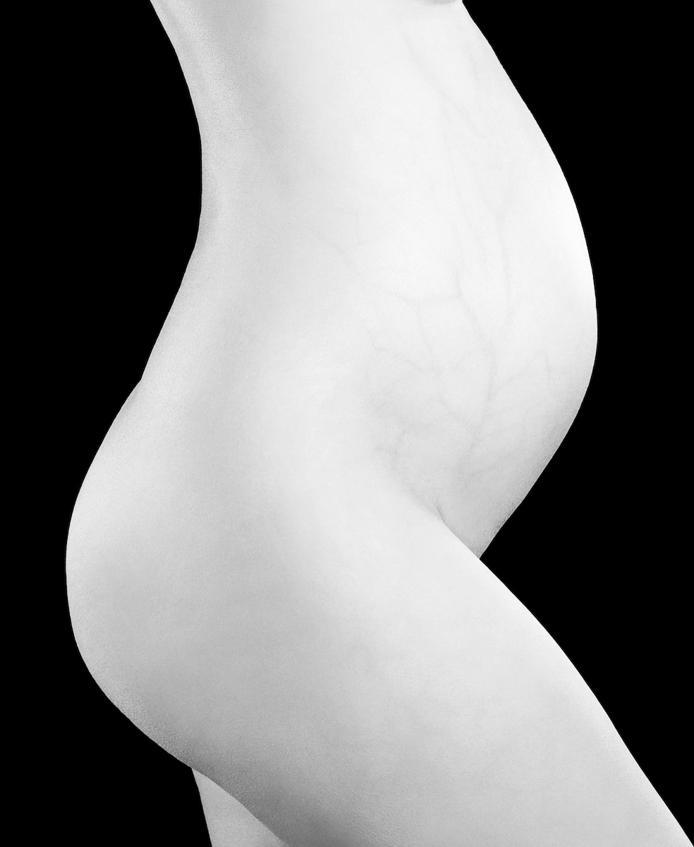 A black and white photo of a woman's butt.