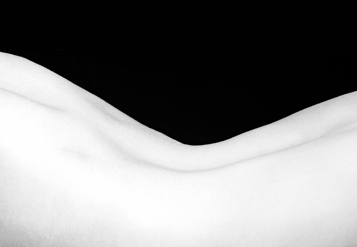 A black and white photo of a woman's torso.