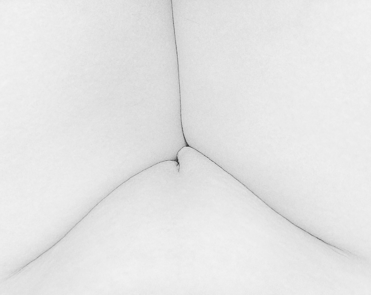 A black and white photo of a woman's butt.