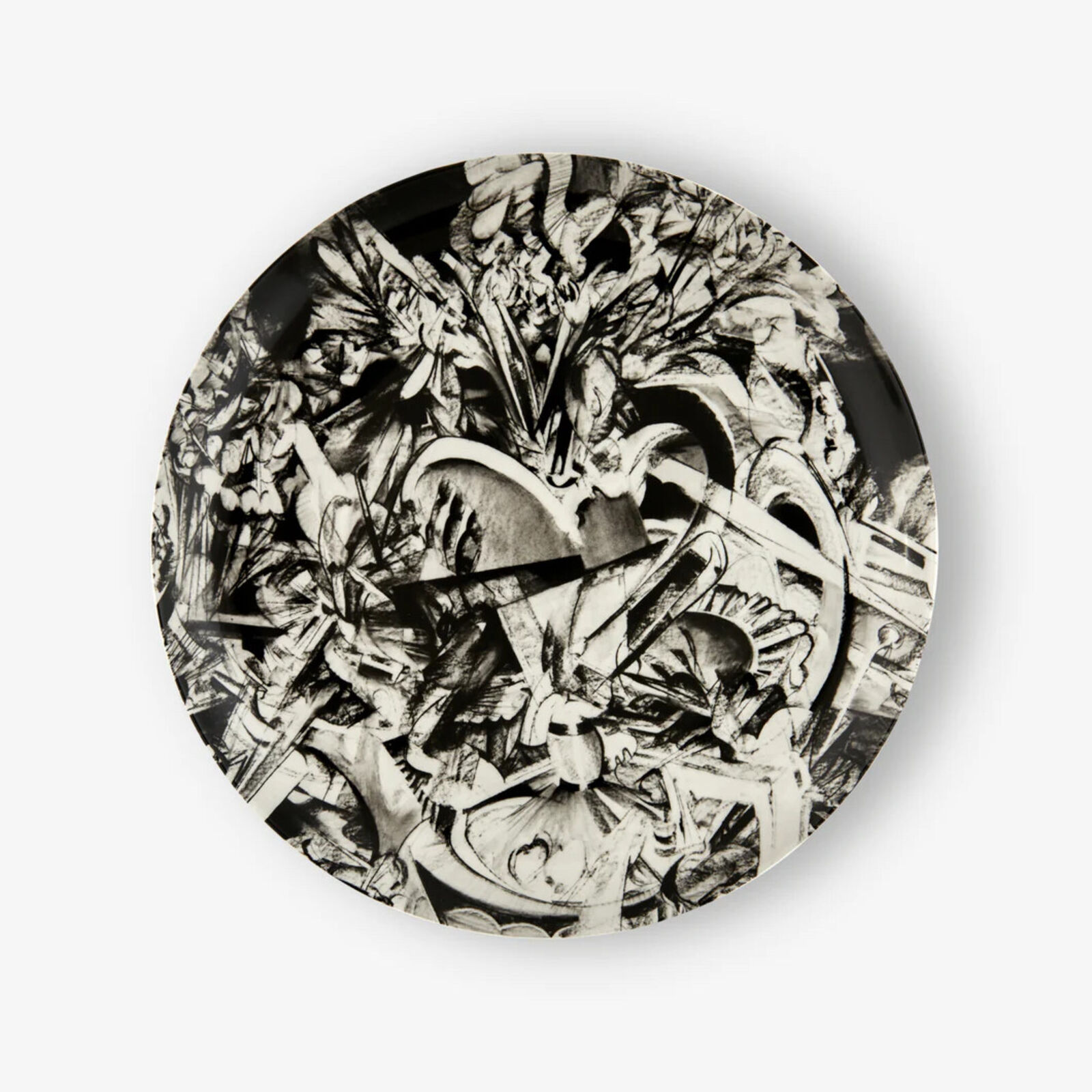 A black and white plate with a drawing on it.