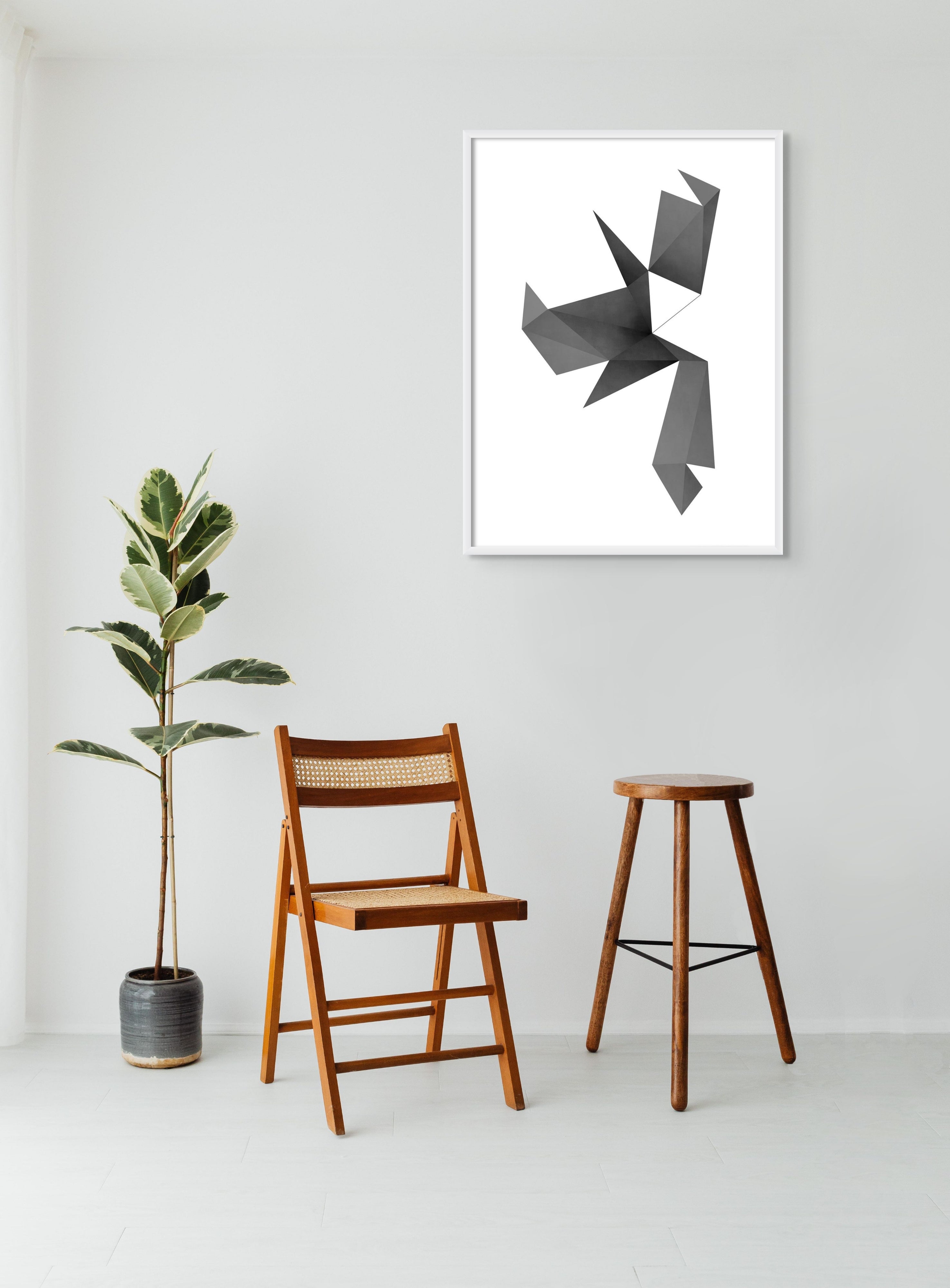 A black and white poster of a bird made out of paper.