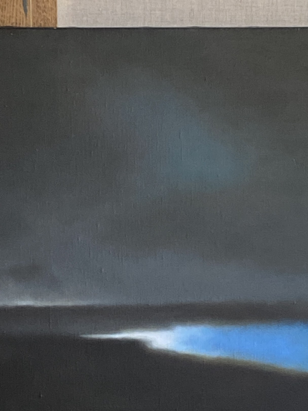 A painting of a dark sky over a body of water.
