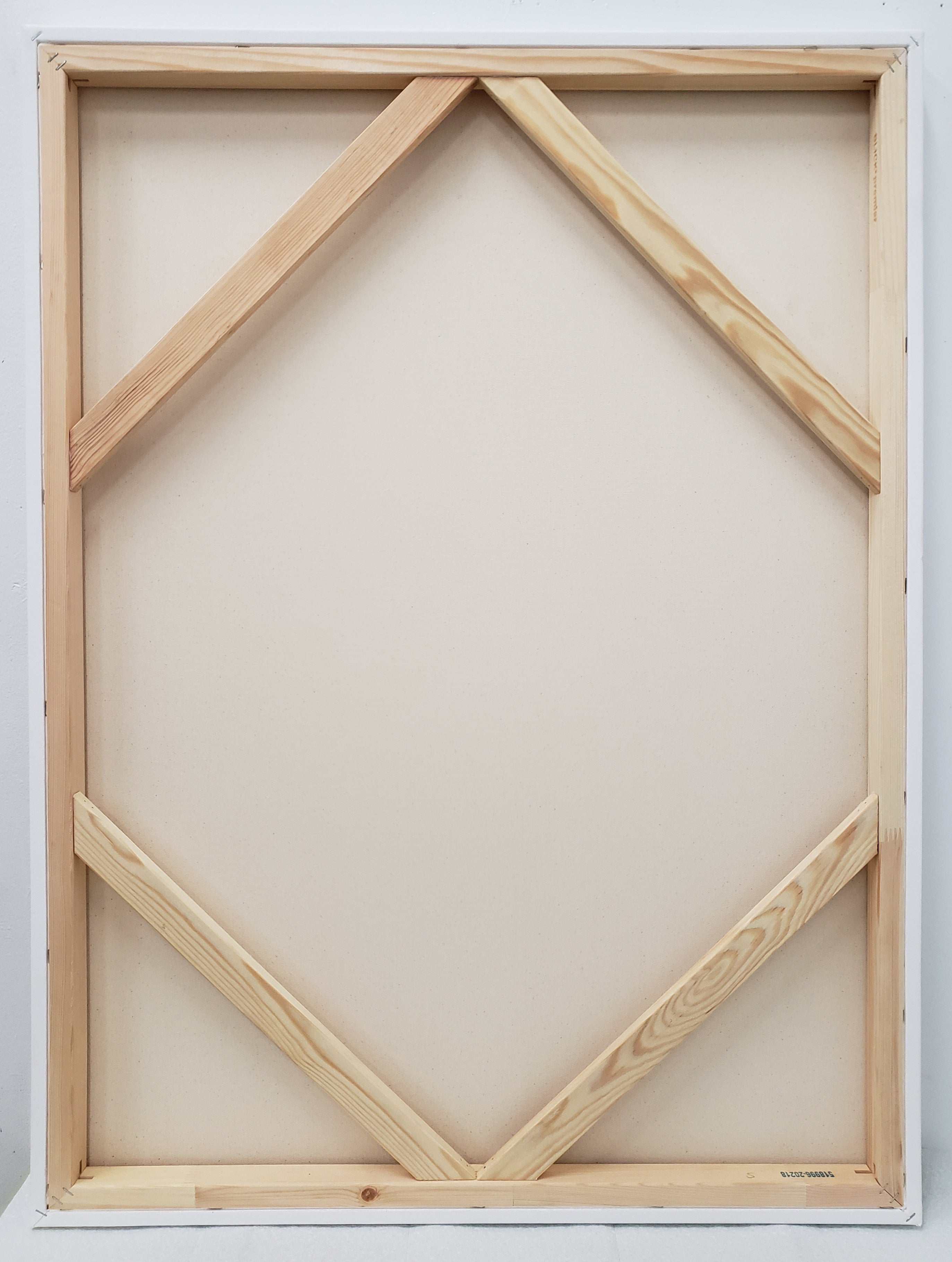 A pink and blue painting on a white wall.
