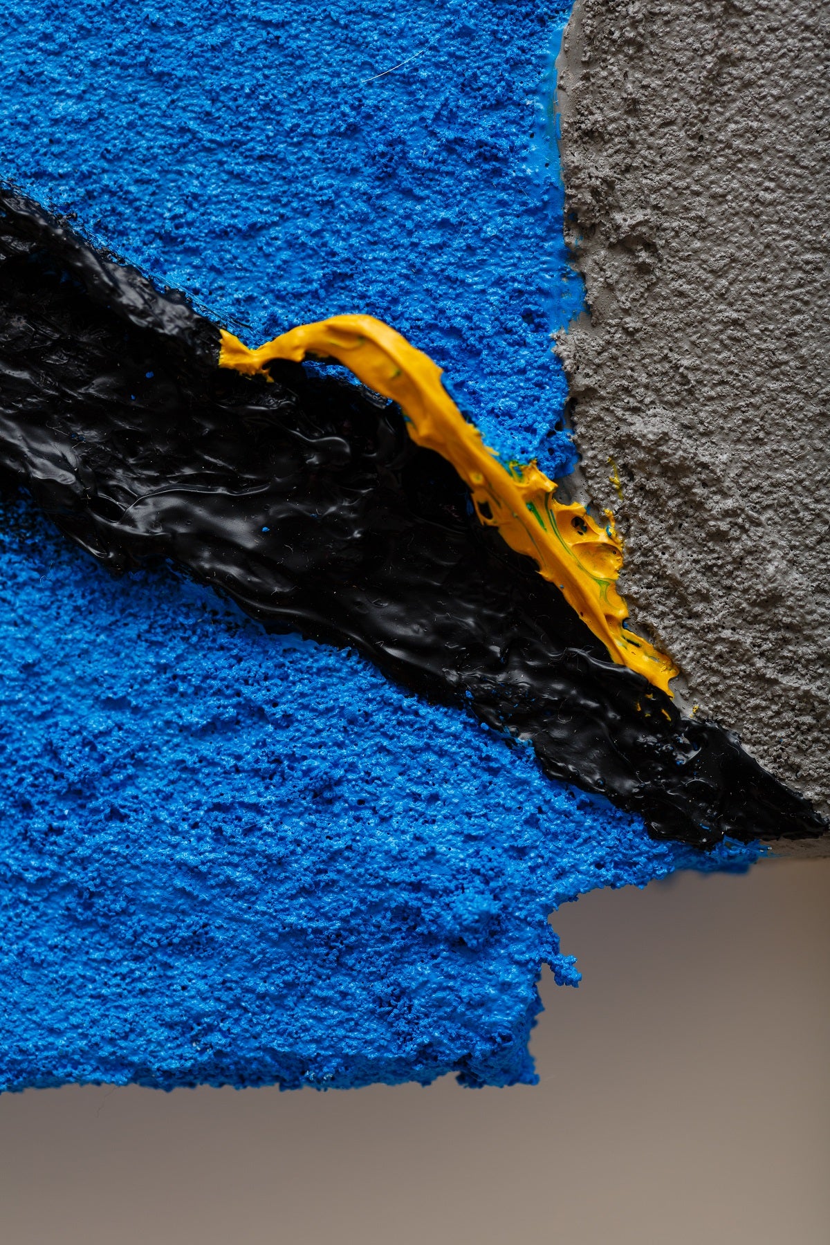 A piece of art that is on a white surface.