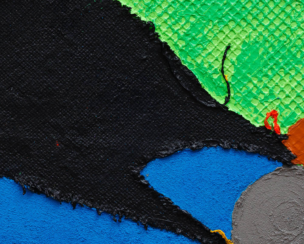 A piece of art that is on a white surface.