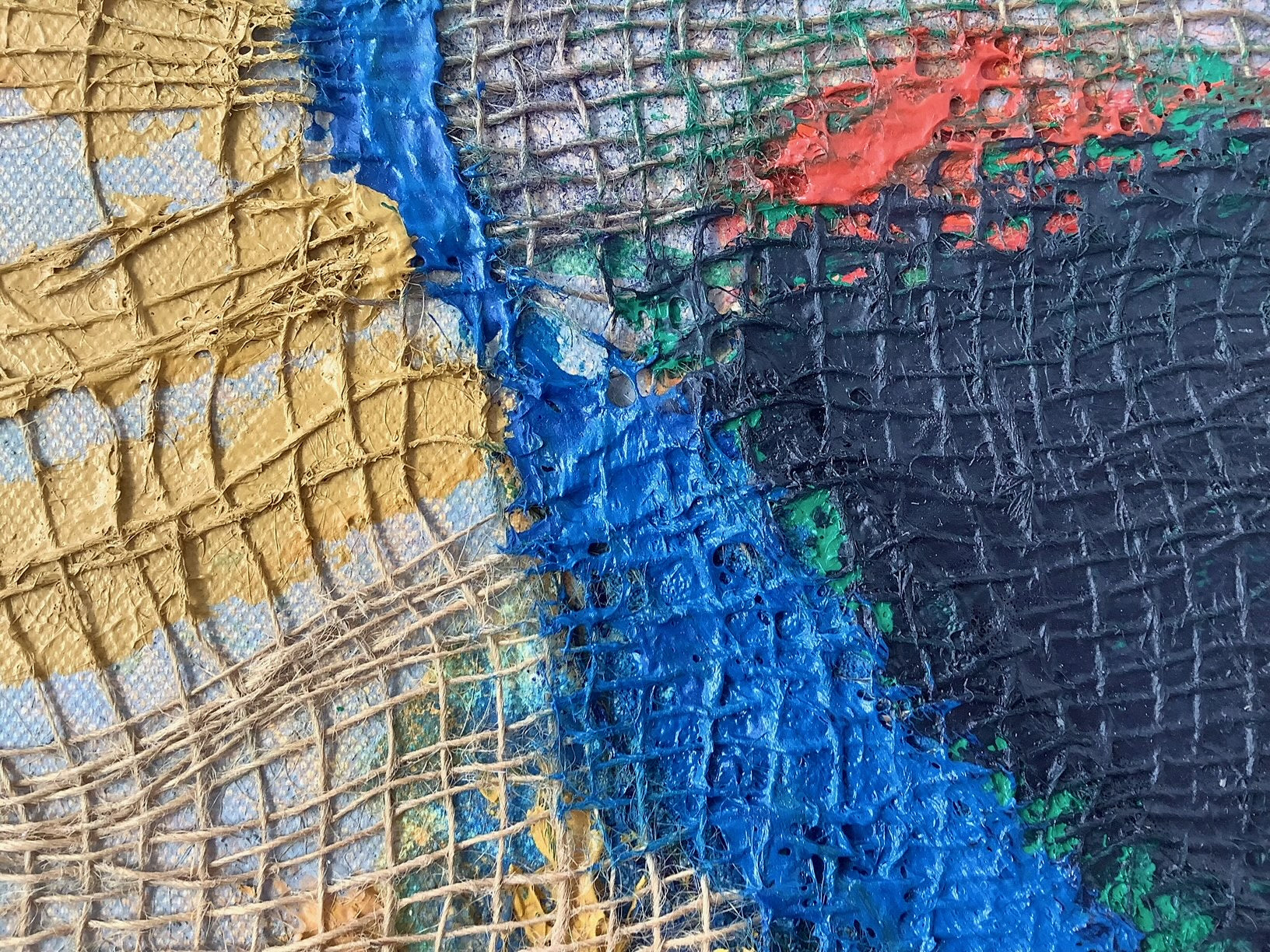 A close up of a piece of art on a white background.