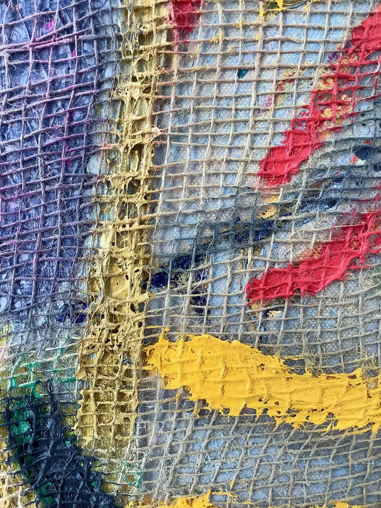 A close up of a piece of art on a white background.