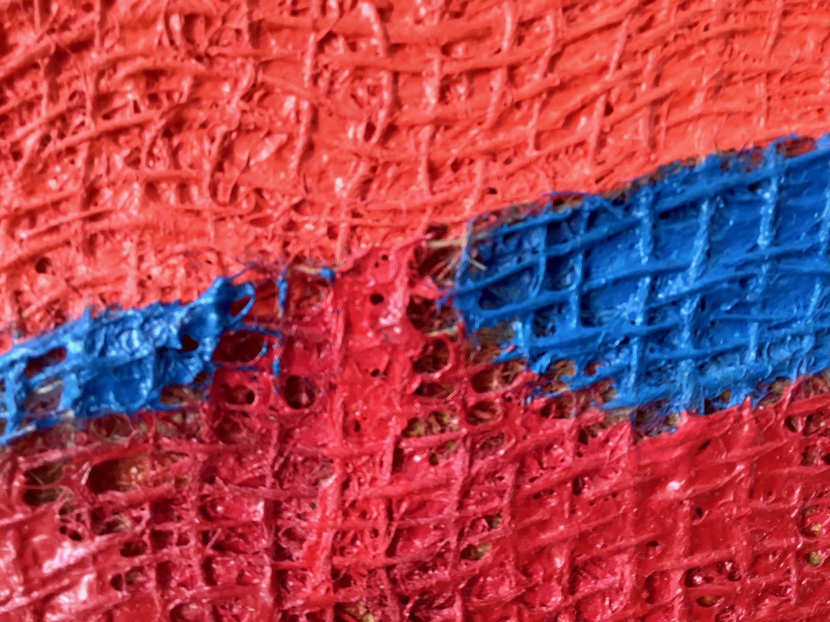 A close up of a piece of art on a white background.