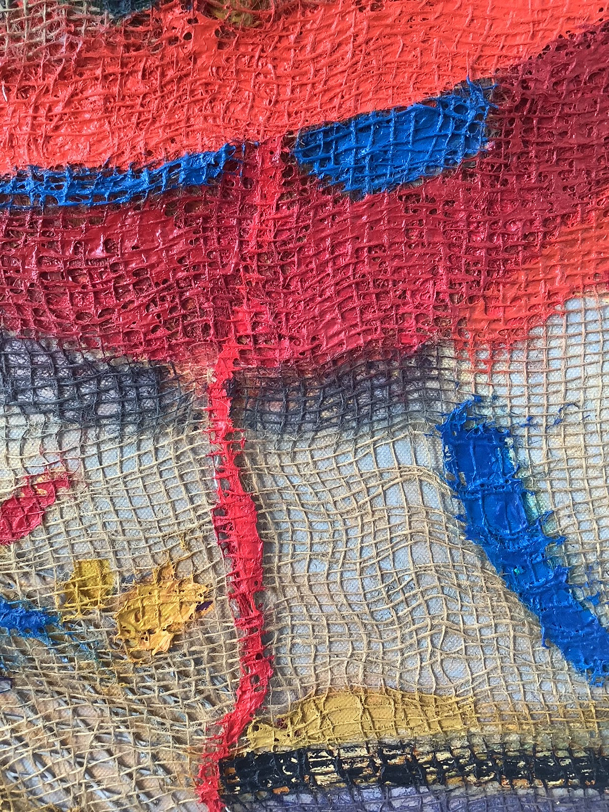 A close up of a piece of art on a white background.