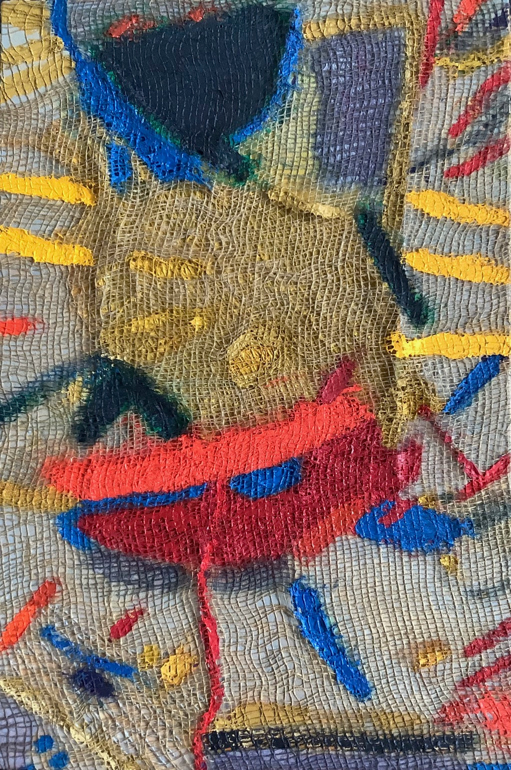 A close up of a piece of art on a white background.