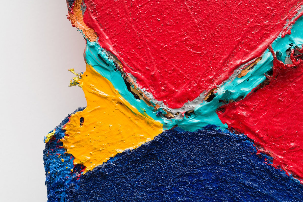 A piece of art that is on a white surface.