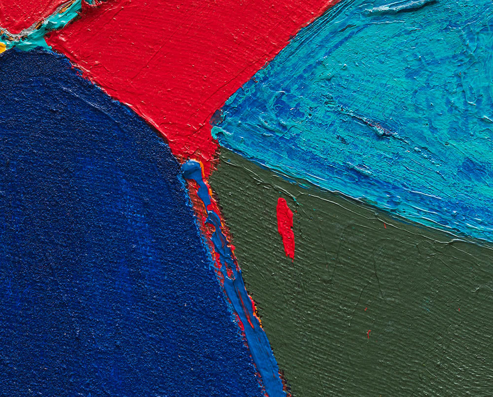 A piece of art that is on a white surface.