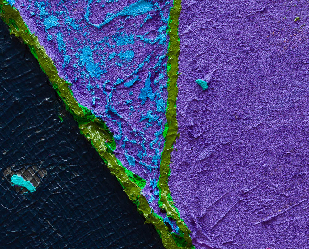 A piece of art that is on a white surface.