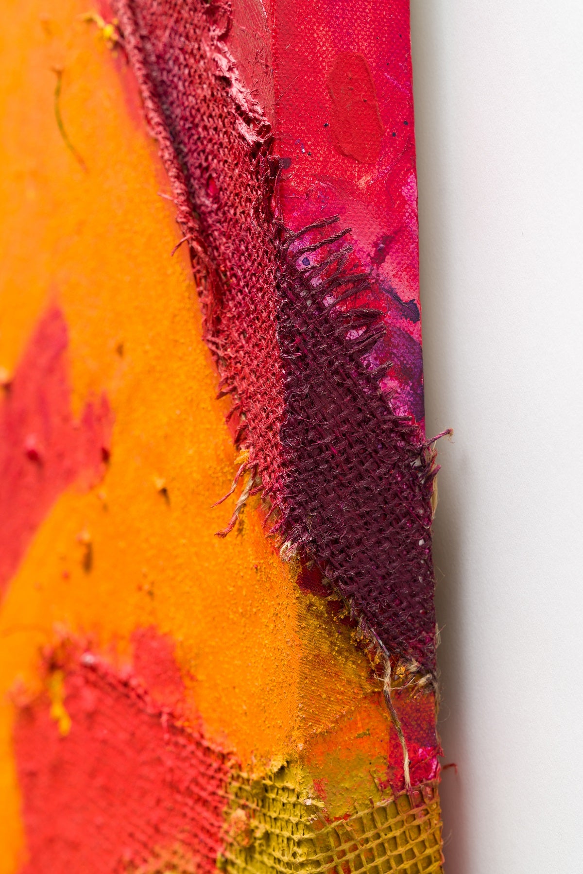 A painting of a red, yellow and orange abstract painting.