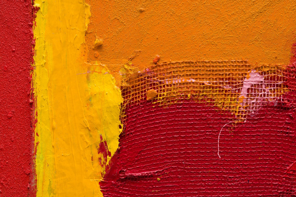 A painting of a red, yellow and orange abstract painting.