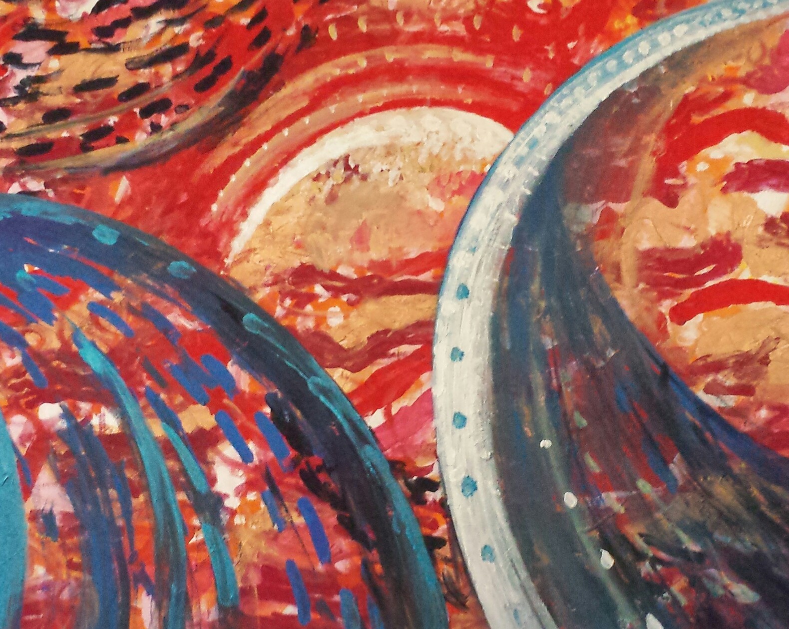 A painting of a red and blue abstract painting on a canvas.