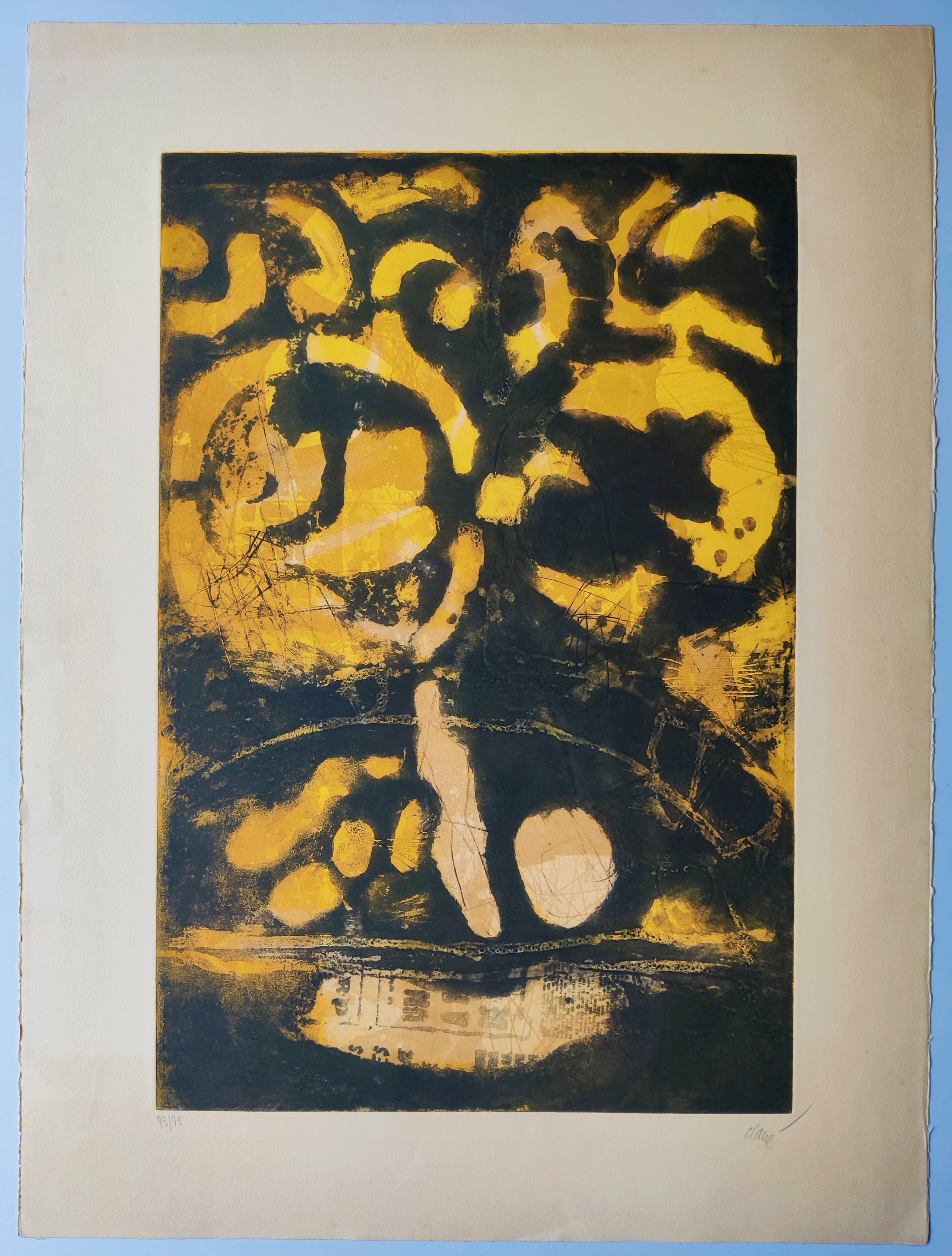 An abstract print featuring a stylized face in yellow and black.