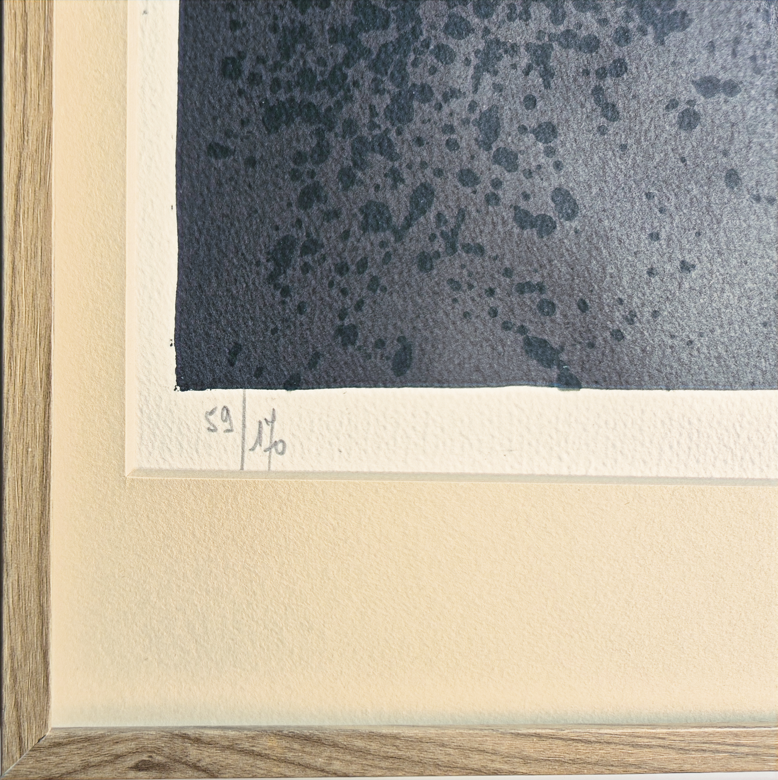 A black and white painting hanging on a wall in a room.