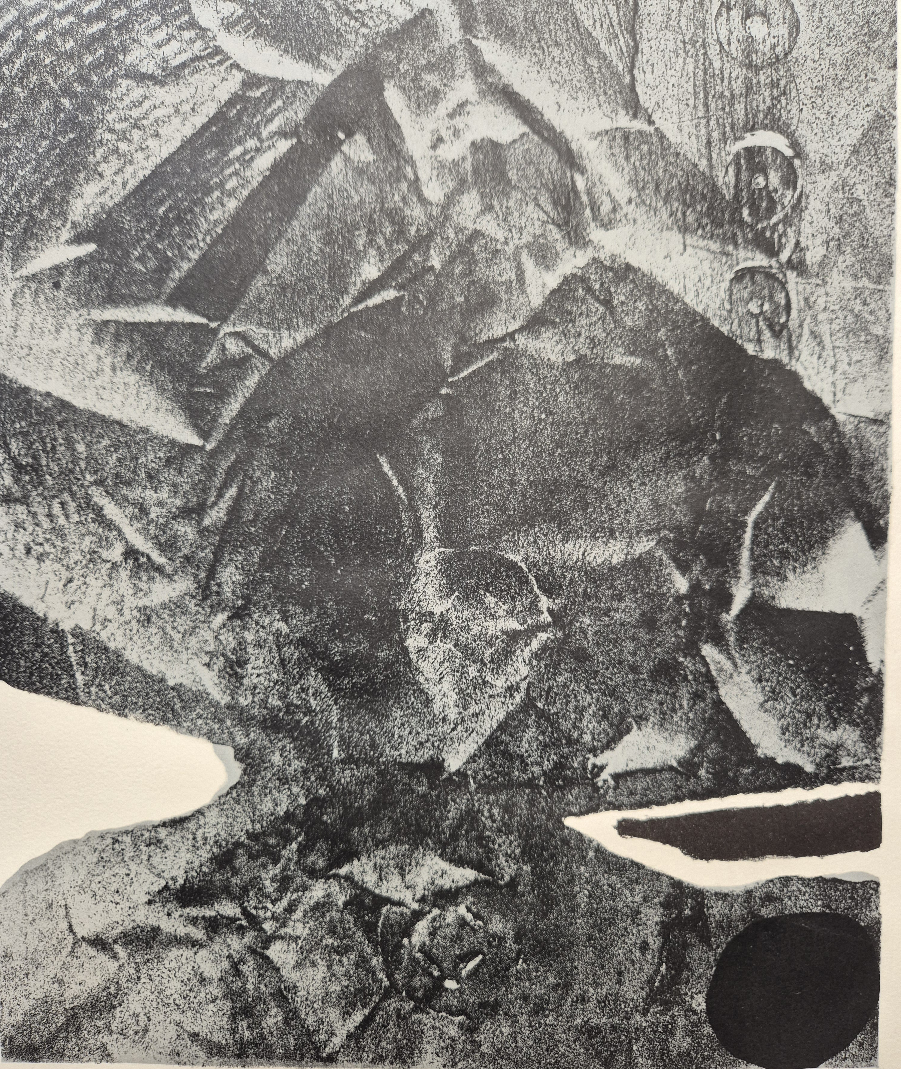 A black and white drawing of a rock in a frame.