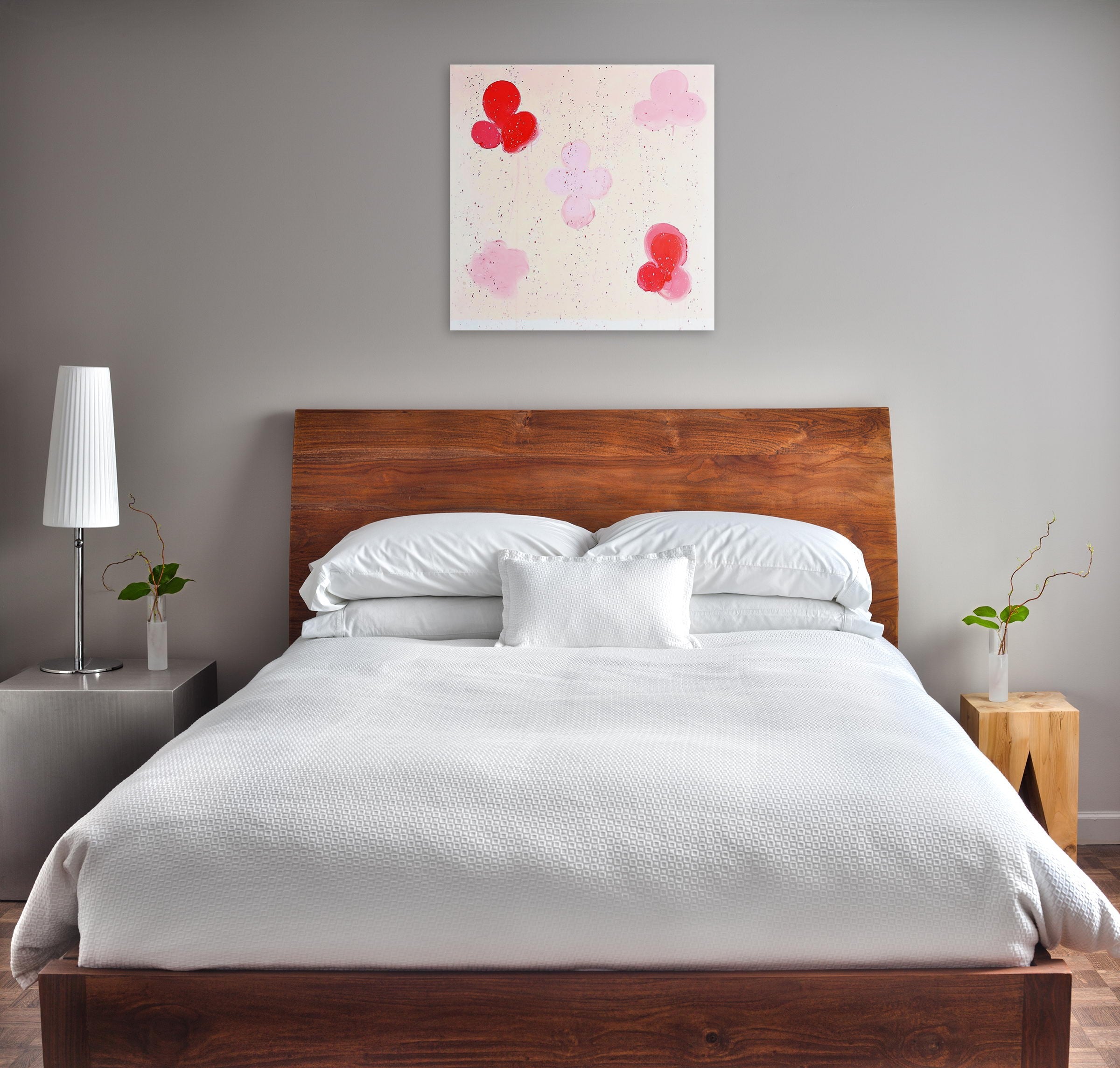 A painting of red and pink balloons floating in the air.